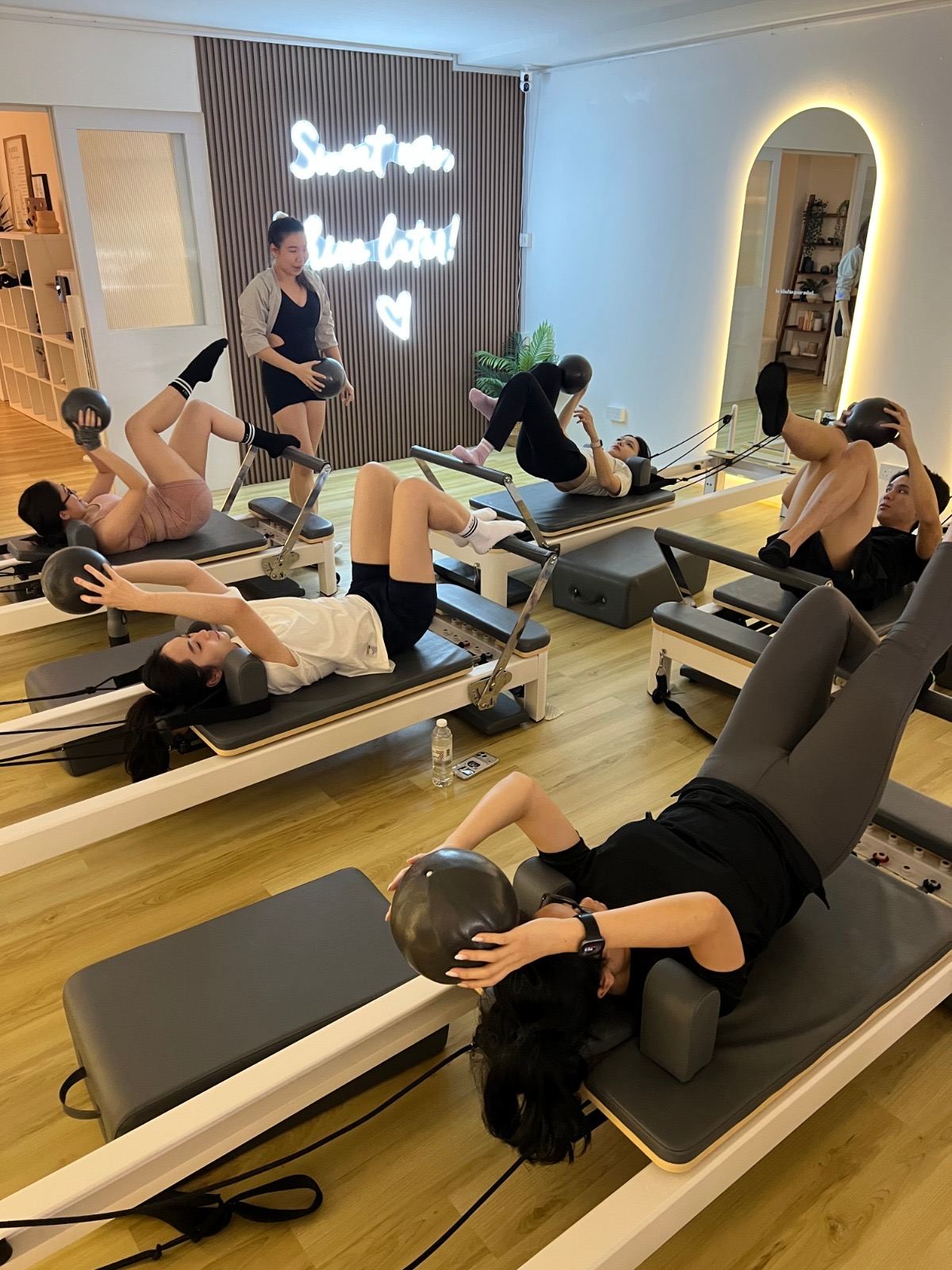 Group reformer Pilates class in progress